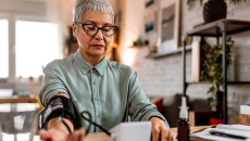 Woman monitoring her blood pressure
