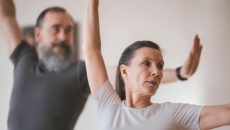 Two elderly people doing exercises