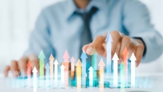 Businessperson and a digital interpretation of a financial graph