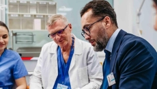 Advisor sitting with healthcare professionals