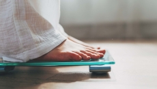 Person's feet while they are standing on a scale