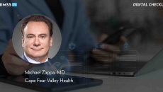 Dr. Michael Zappa, Cape Fear Valley Health_Using tablet to manage digital health checklist_Panchanut Chobjit/iStock/Getty Images Plus