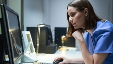 Healthcare professional reviewing data