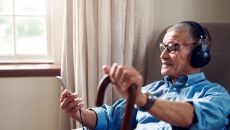 man in chair with cane