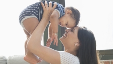 One person holding another person above their head