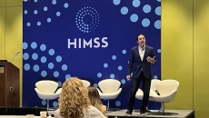 Aaron Miri, senior vice president and chief digital and information officer at Baptist Health on stage at HIMSS23