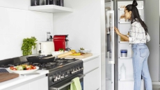 Person looking into a refrigerator