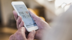 Person viewing their vitals on a smartphone