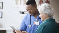 Nurse consulting with patient