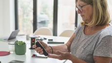 A woman checking her blood sugar.