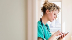 A provider typing onto a tablet