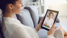 Patient using telehealth to talk to a healthcare professional on a tablet