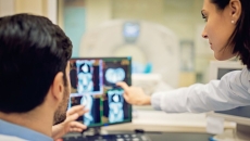 Doctors analysing a CT scan