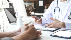 A doctor and patient in a face-to-face consultation