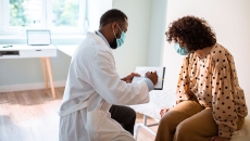 A woman talking to her doctor