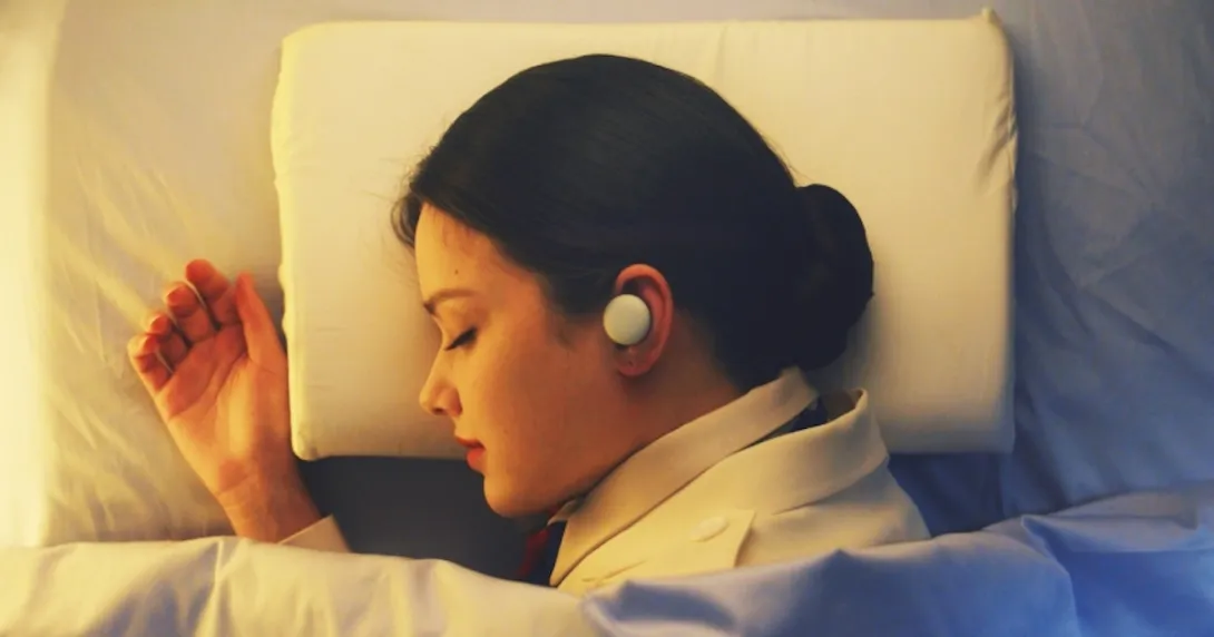 A sleeping person wearing the Breeze earphone, LG Electronics' latest sleep care offering