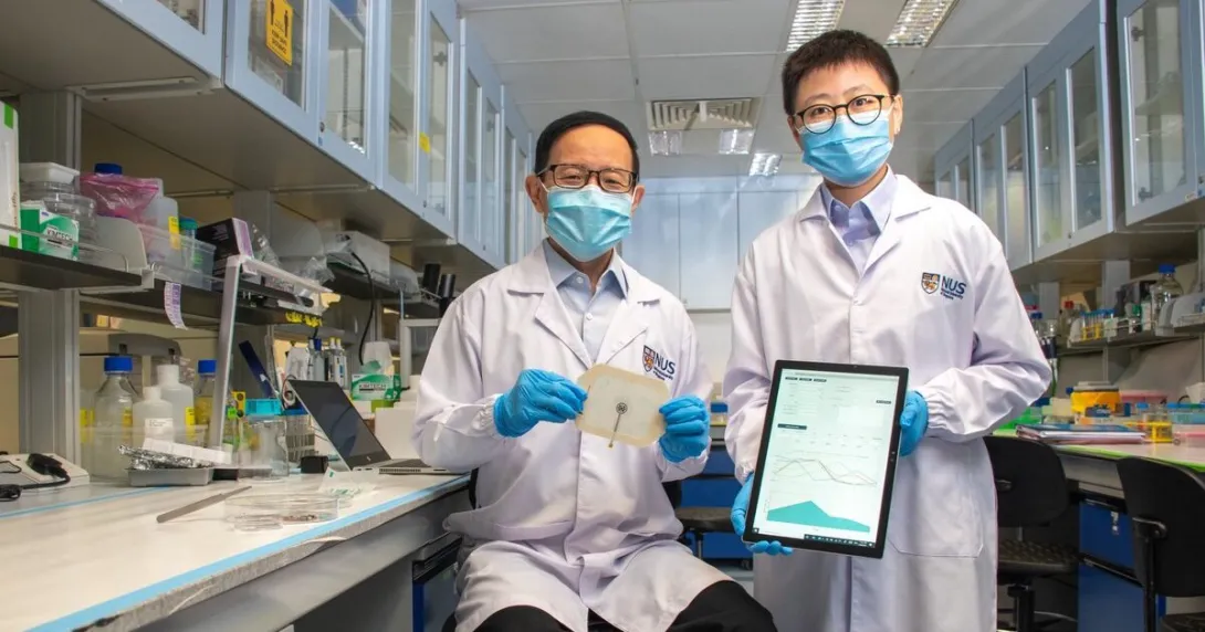 NUS team lead researchers pose with the VeCare platform for monitoring chronic wounds.
