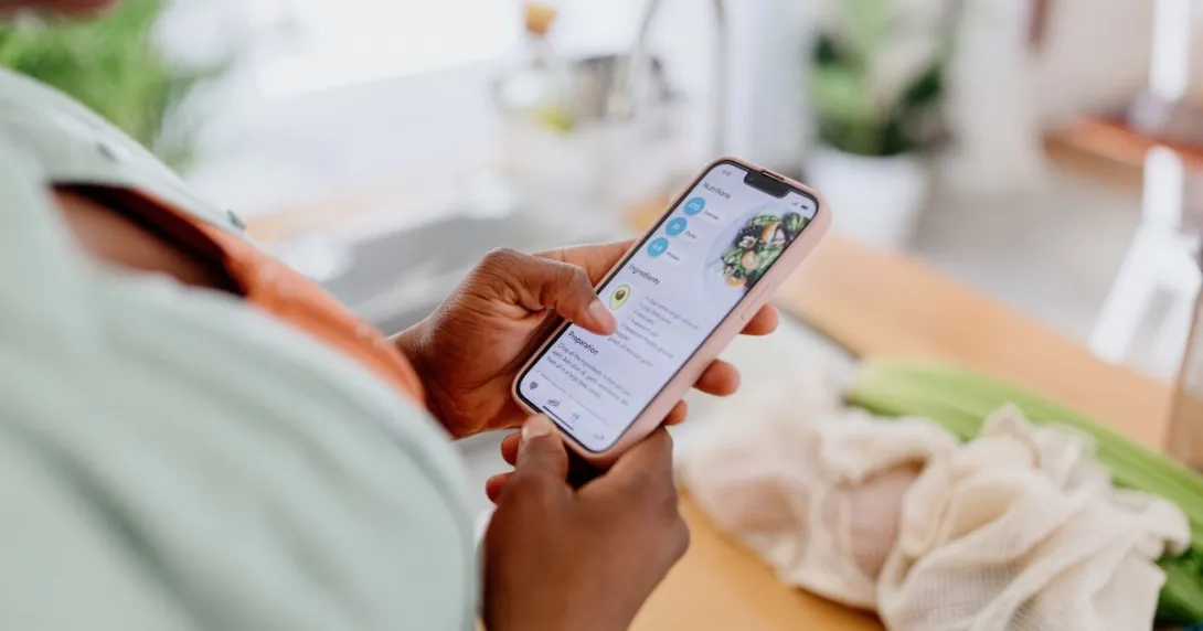Person looking at a health app on their phone