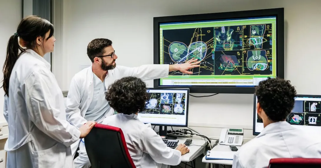 Four healthcare providers looking at a screen