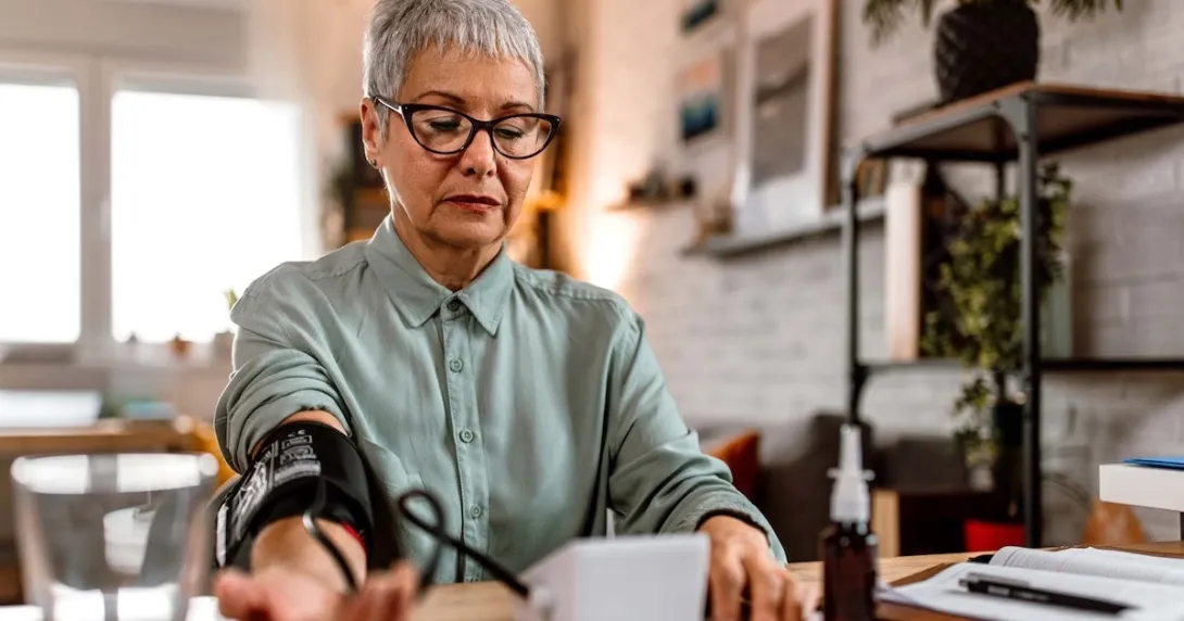Woman monitoring her blood pressure