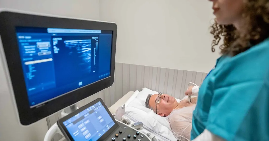 Technician conducting ultrasound exam