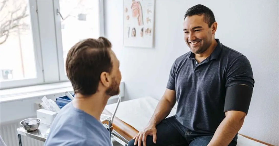 Patient sitting with a healthcare professional
