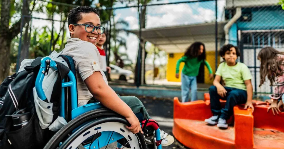 Student in a wheelchair on a playground