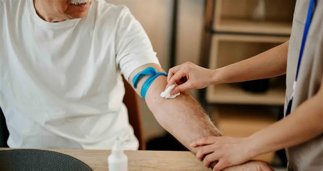 Nurse drawing blood from a person