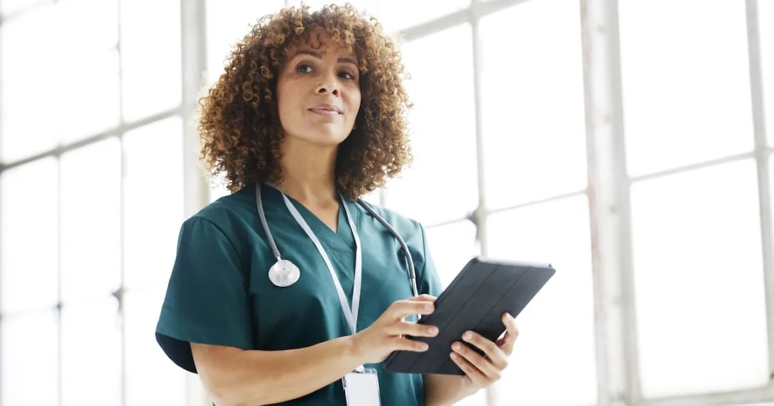Healthcare provider holding a tablet