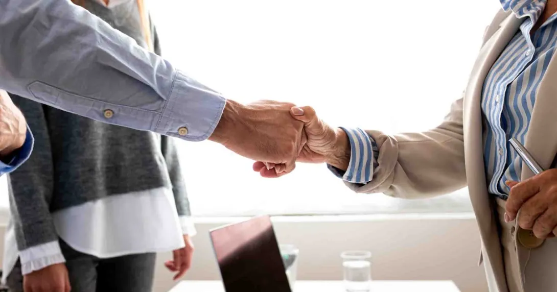 Two people shaking hands