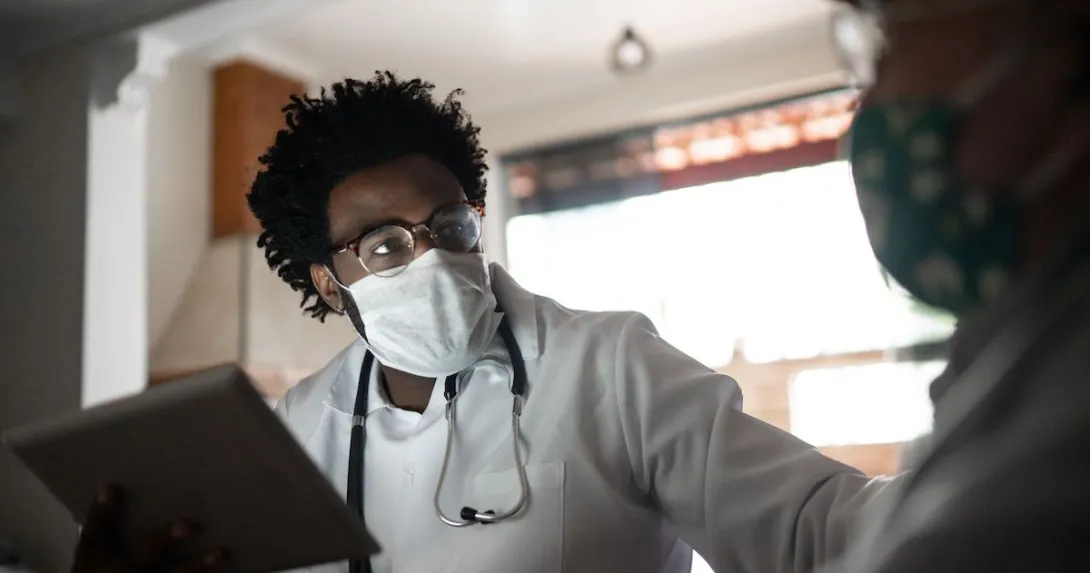 Healthcare provider caring for a patient in their home