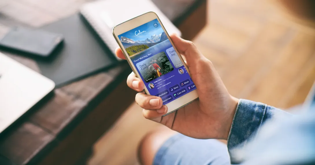 A close-up of a person using the Calm app on a smartphone.