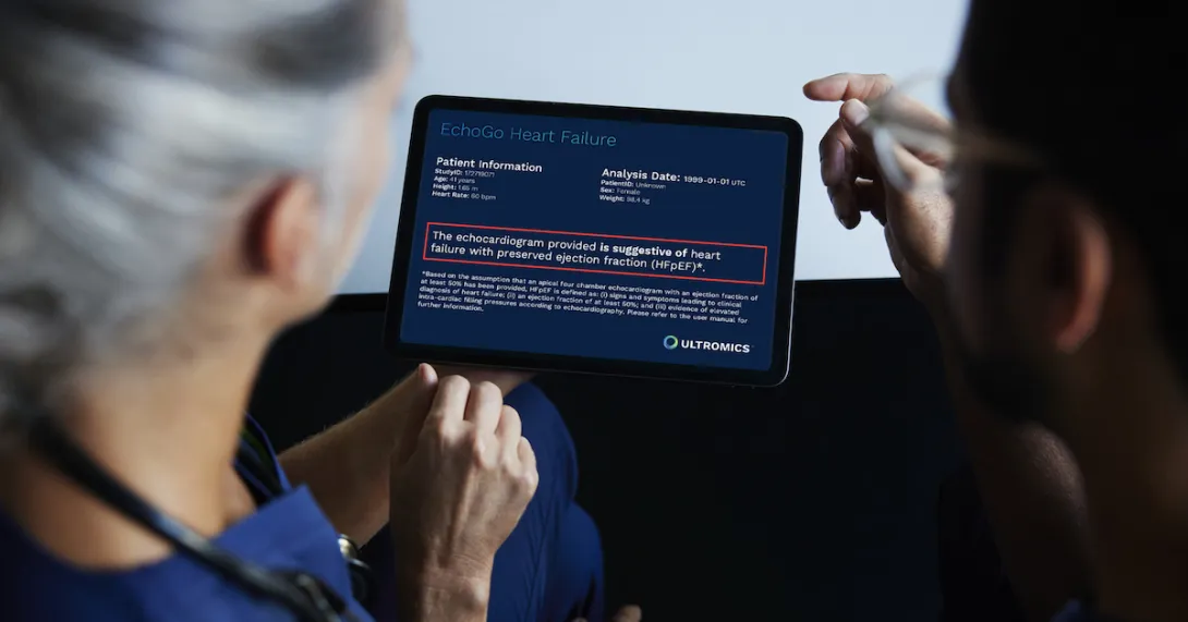 Two people reading a tablet with analysis from EchoGo Heart Failure