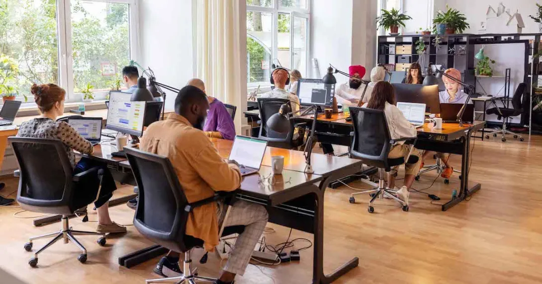 Employees sitting in an open working room