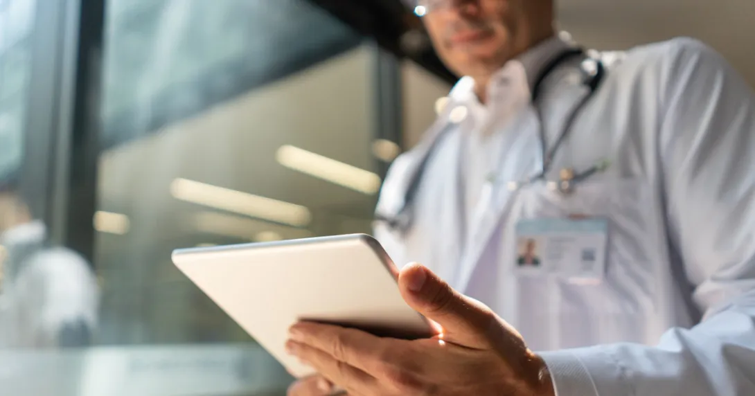 Healthcare provider holding a tablet