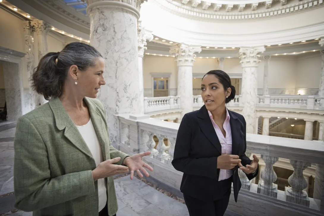Two legislators talking in the U.S. Capitol