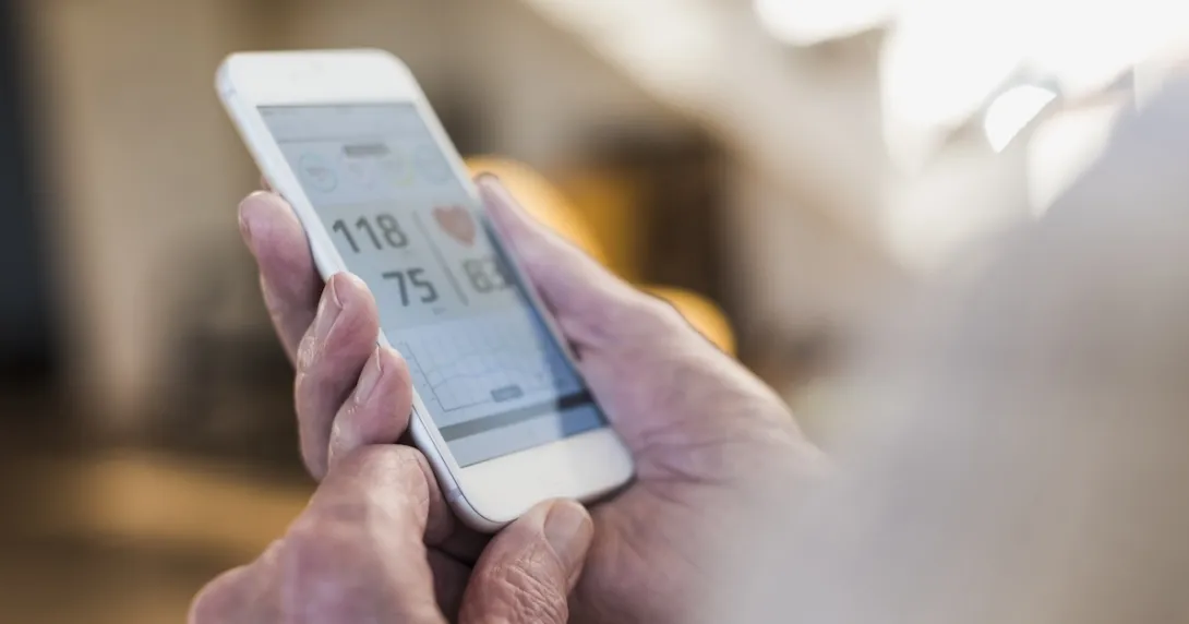Photo of a smart phone showing blood pressure reading