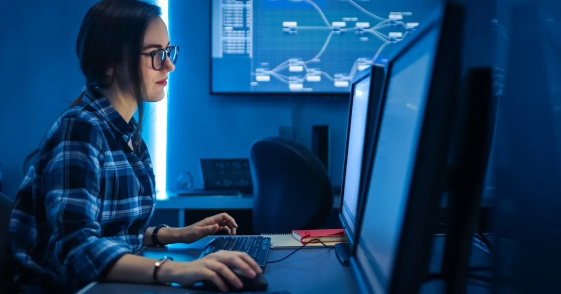 Technician looking at PC screen