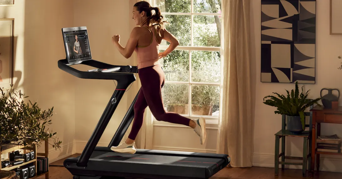 A person exercising on a Peloton treadmill