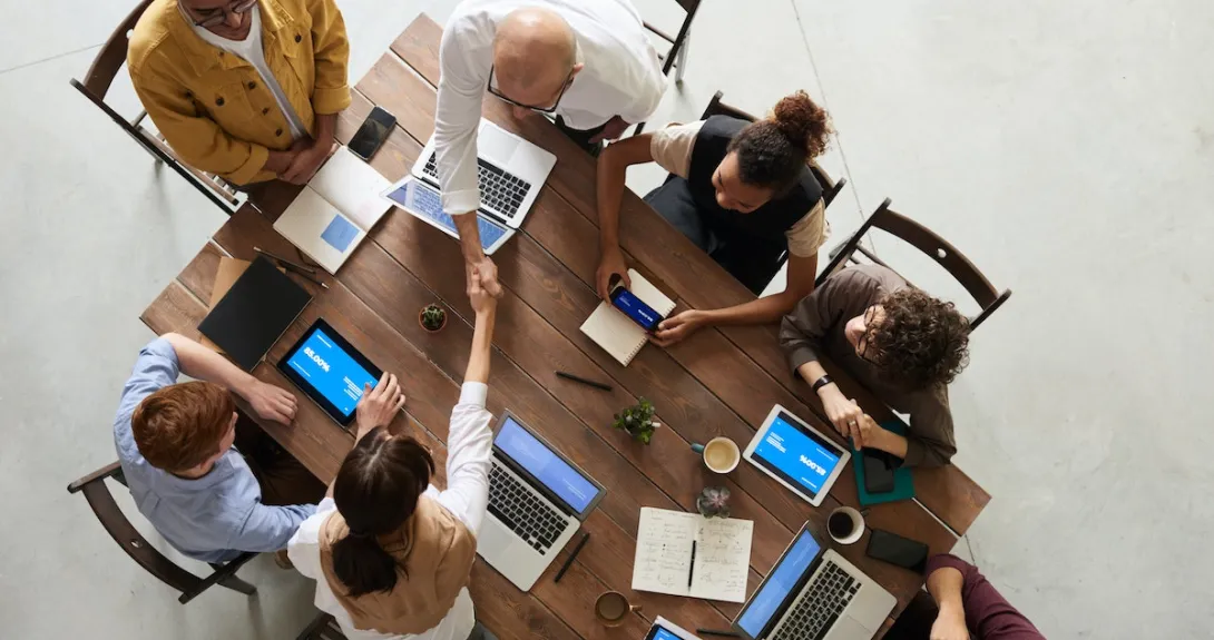 Business people shaking hands at a table