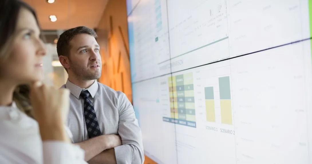 Businesspeople looking at financial results