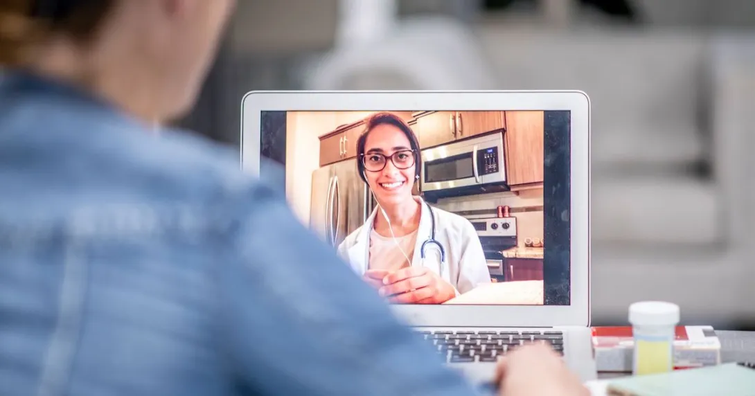 A patient talking to a provider via telehealth