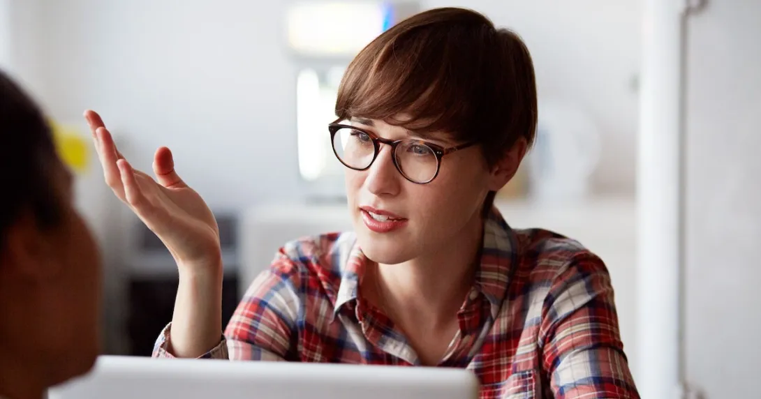 Person on a computer talking and wearing glasses